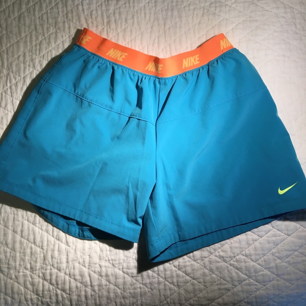 Blue Nike running shorts